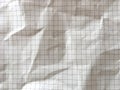 Light brown grid math paper wrinkled texture background Royalty Free Stock Photo