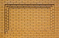 Light brown rectangular concave brick wall background