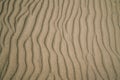 Light brown sand texture background, windy day on the beach, pattern, abstract Royalty Free Stock Photo