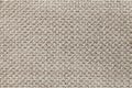 Light brown textile background with checkered pattern, closeup. Structure of the fabric macro. Royalty Free Stock Photo