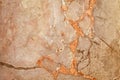 Light brown wall with orange streaks. Stone surface texture background