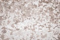 Light brown and white concrete wall. Shabby dirty rough surface. Old stucco. Cement texture, abstract grunge background. Modern ar Royalty Free Stock Photo