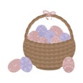 Light brown wicker basket Easter with patterned flowers pink and blue eggs and a pink bow isolated on white background
