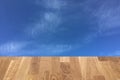 Light brown wooden planks as a wood table or parquet floor in perspective, isolated on blue sky or white clouds Royalty Free Stock Photo