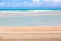 Light brown wooden table against amazing ocean view. Mockup image