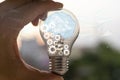 Light bulb with brain inside the hands of the businessman Royalty Free Stock Photo