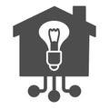 Light bulb in building solid icon, smart home concept, Electricity with connections sign on white background, House with