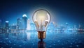 Light bulb with cityscape reflection on abstract background. 3D Rendering Royalty Free Stock Photo