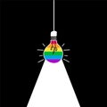 Light bulb with the colours of the pride flag on a black background. Concept of gender equality in business. Creativity and Royalty Free Stock Photo