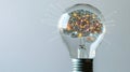 Light bulb containing glowing brain symbolizing innovation and creativity