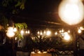 Light bulb decor in outdoor party. Wedding Royalty Free Stock Photo