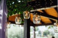 Light bulb decor in outdoor wedding ceremony Royalty Free Stock Photo