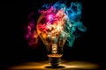 Light bulb filled with colorful fire, representing concept of new life and new ideas Royalty Free Stock Photo