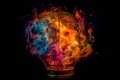 Light bulb filled with colorful fire, representing concept of new life and new ideas Royalty Free Stock Photo