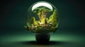 Light bulb filled with green leaves, house and plants. Concept of renewable and clean energy, sustainable resources, Earth Day Royalty Free Stock Photo