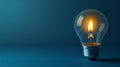 Light bulb with flame on blue background, creative concept. Innovation and energy concept Royalty Free Stock Photo
