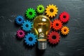 Light bulb and gear colored wheels Royalty Free Stock Photo