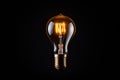 Light bulb with glowing yellow light inside of it on black background. Generative AI Royalty Free Stock Photo