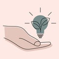Light bulb in the hand. Creative problem solving. Hand holds green ecology light bulb and green plant, green energy concept. Royalty Free Stock Photo