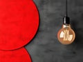 A light bulb hanging from a string on a red and black background Royalty Free Stock Photo