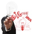 Light bulb head draws the big idea with red pen Royalty Free Stock Photo