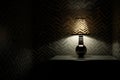 light bulb illuminating a dark room with shadows and patterns Royalty Free Stock Photo