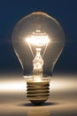Light bulb isolated on blue background Royalty Free Stock Photo