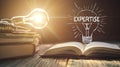 A light bulb is lit up and the word "expertise" is written below it Royalty Free Stock Photo