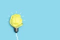 Light bulb made with yellow crumpled paper