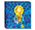 Light bulb moving with puzzle pieces, many parts needed for success. One of the puzzle pieces is in gold.