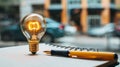Light bulb, notepad and pencil on table. Concept of idea generation and creativity. Writing stories and drawing. Royalty Free Stock Photo