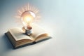 A light bulb in an open book on a light background. Space for text. Royalty Free Stock Photo