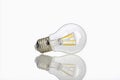 Light bulb placed on pure white background showcasing its form and design Generative AI Royalty Free Stock Photo