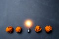 light bulb put in the middle of orange papers it for idea,energy,solar concept Royalty Free Stock Photo