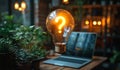A light bulb with a question mark on it is floating above a laptop computer Royalty Free Stock Photo