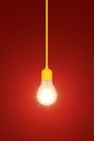 Light bulb on a red background Royalty Free Stock Photo