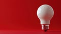Light bulb on red background symbolizes creativity and innovation in design concepts and ideas Generative AI Royalty Free Stock Photo