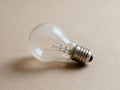Light Bulb on Table Close Up - AI generated Royalty Free Stock Photo