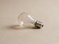Light Bulb on Table Close Up - AI generated Royalty Free Stock Photo