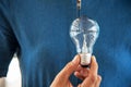 Light bulb in woman hand. Idea and Creative concept. Success and Thinking concept. Object and People theme