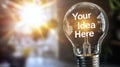 Light bulb with the words Your Idea Here Royalty Free Stock Photo