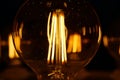 Light bulbs with big yellow filaments inside in vintage style Royalty Free Stock Photo