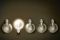 Light bulbs on dark background. Concept of choice, creativity, idea. Royalty Free Stock Photo