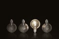 Light bulbs on dark background. Concept of choice, creativity, idea. Royalty Free Stock Photo