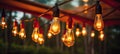 light bulbs hanging in a tent at night Royalty Free Stock Photo