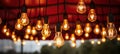 light bulbs hanging in a tent at night Royalty Free Stock Photo