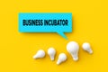 Light bulbs with a speech bubble with the business incubator. Business startup service support concept. 3D rendering Royalty Free Stock Photo