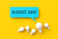 Light bulbs with a speech bubble with the word business ideas. Finding creative business ideas Royalty Free Stock Photo