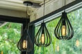 Light bulbs on vintage steel ceiling lamp cafe Royalty Free Stock Photo