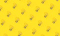 Light bulbs on yellow background in flat lay style Royalty Free Stock Photo